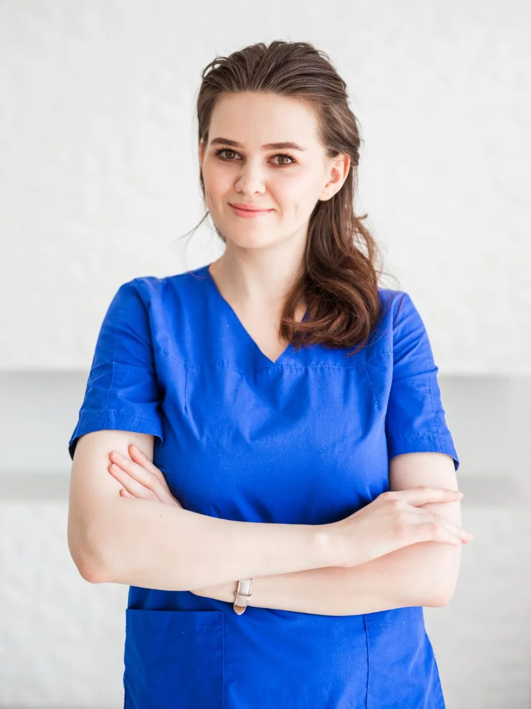 beautiful-young-woman-doctor-posing-blue-medical-suit-edited